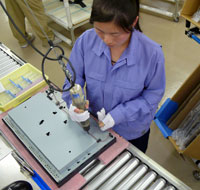 A shielding plate is placed over monitor and then affixed with an electric drill.