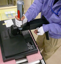 The final stage in the assembly process is the attachment of the stand. The stand shown here is known simply as a "height adjustable stand." EIZO offers a variety of stands, all of which are developed in-house.
